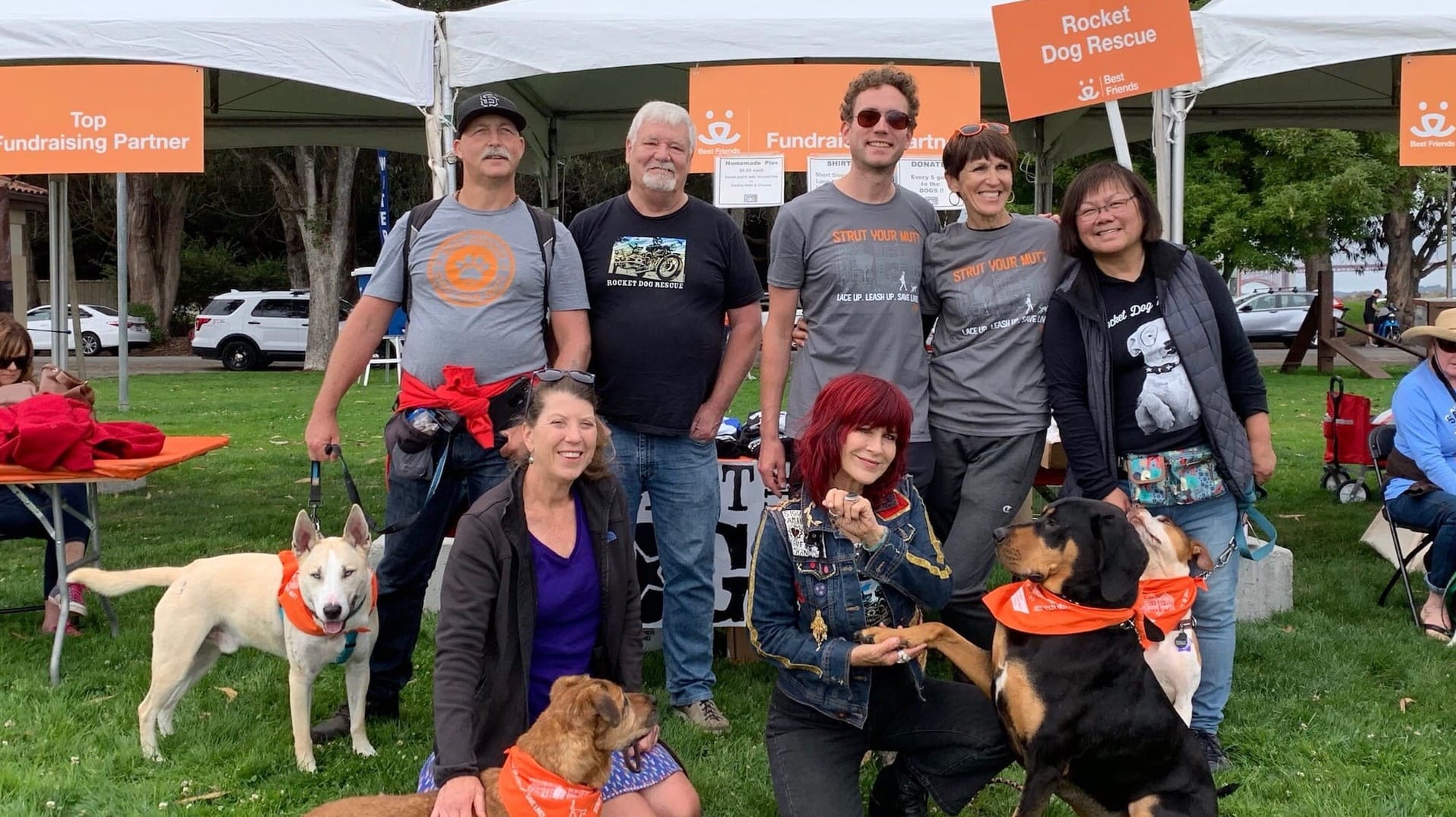 Rocket Dog Rescue volunteers and dog on lawn