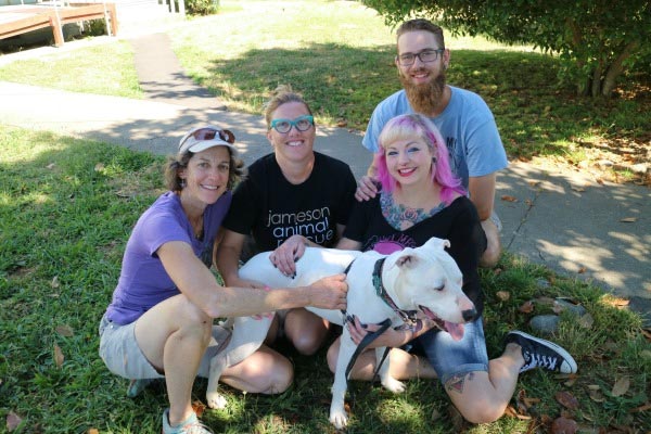 People holding dogs at Jameson Animal Rescue