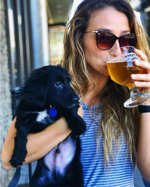 Dog and person at a dog-friendly craft brewery