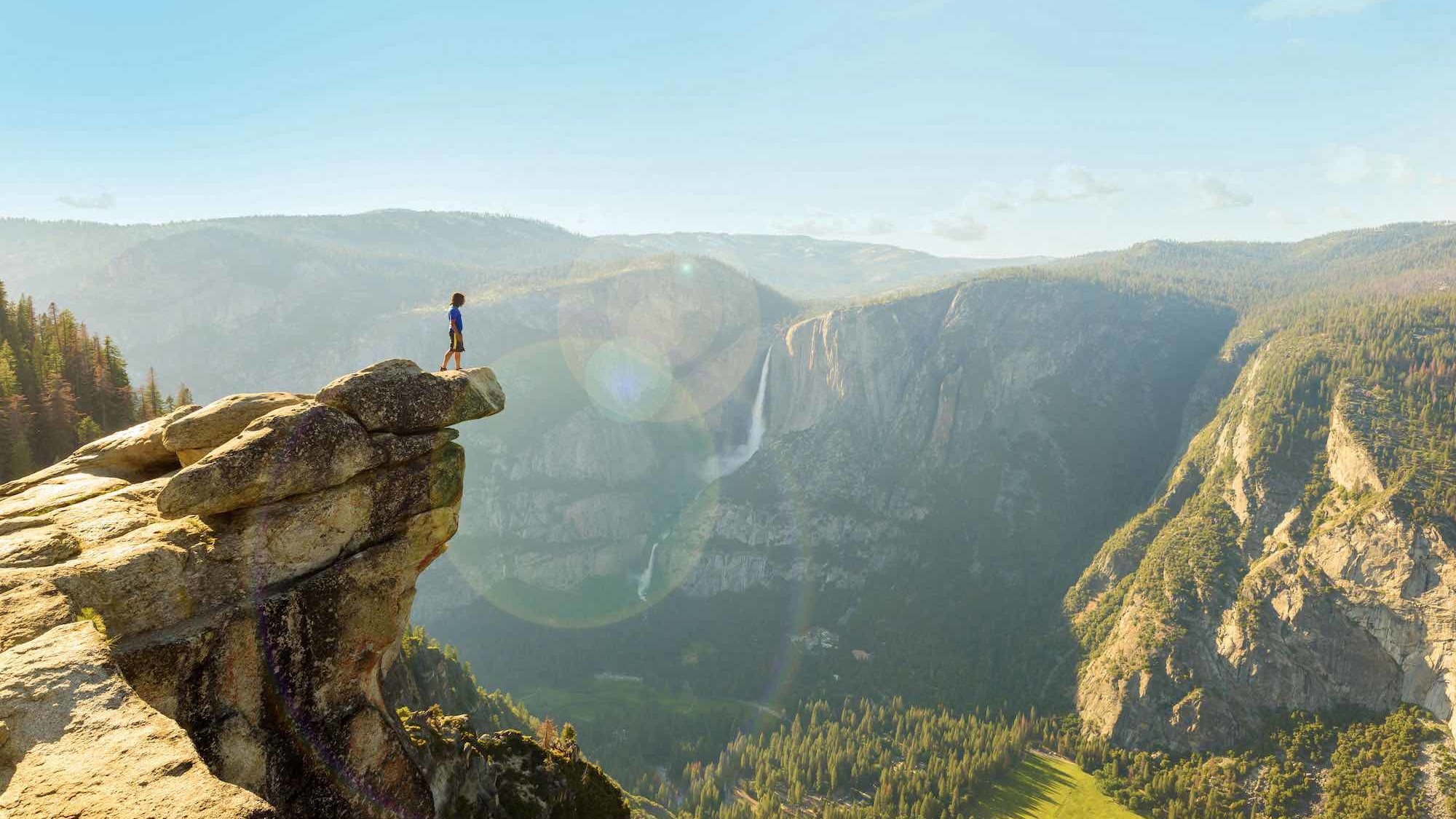 Person on high rock at Yosemite.