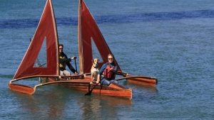 Dog and people on outrigger canoe story
